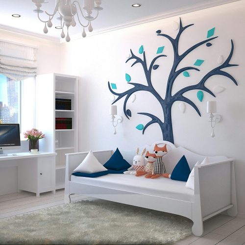 A stylish children's room with a modern design featuring a tree wall art and plush toys.